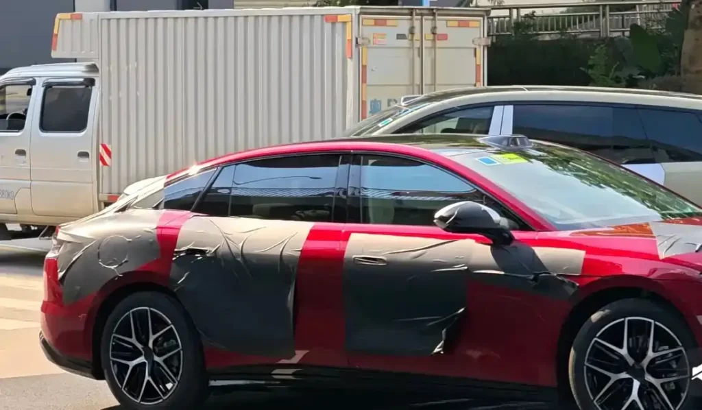 All-new BYD Han red sedan full side view, next-gen BYD Han prototype with camouflage film