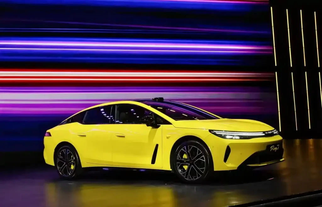 GAC AION Ray7 Lightning Yellow fastback electric sedan on exhibition stage