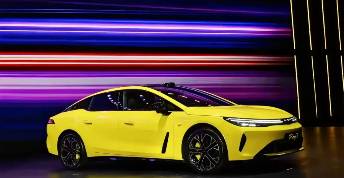 GAC AION Ray7 Lightning Yellow fastback electric sedan on exhibition stage