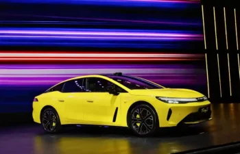 GAC AION Ray7 Lightning Yellow fastback electric sedan on exhibition stage