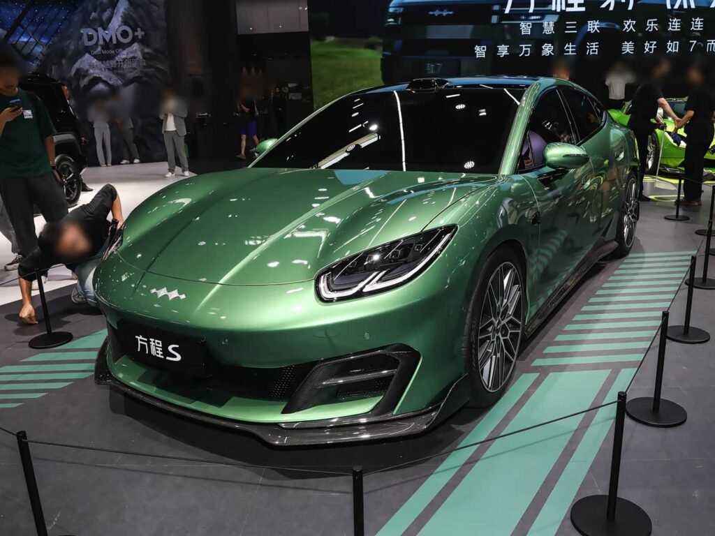 Green Formula Leopard S 2026 all-electric shooting brake car at auto show, front three-quarter view, 657 hp premium performance EV