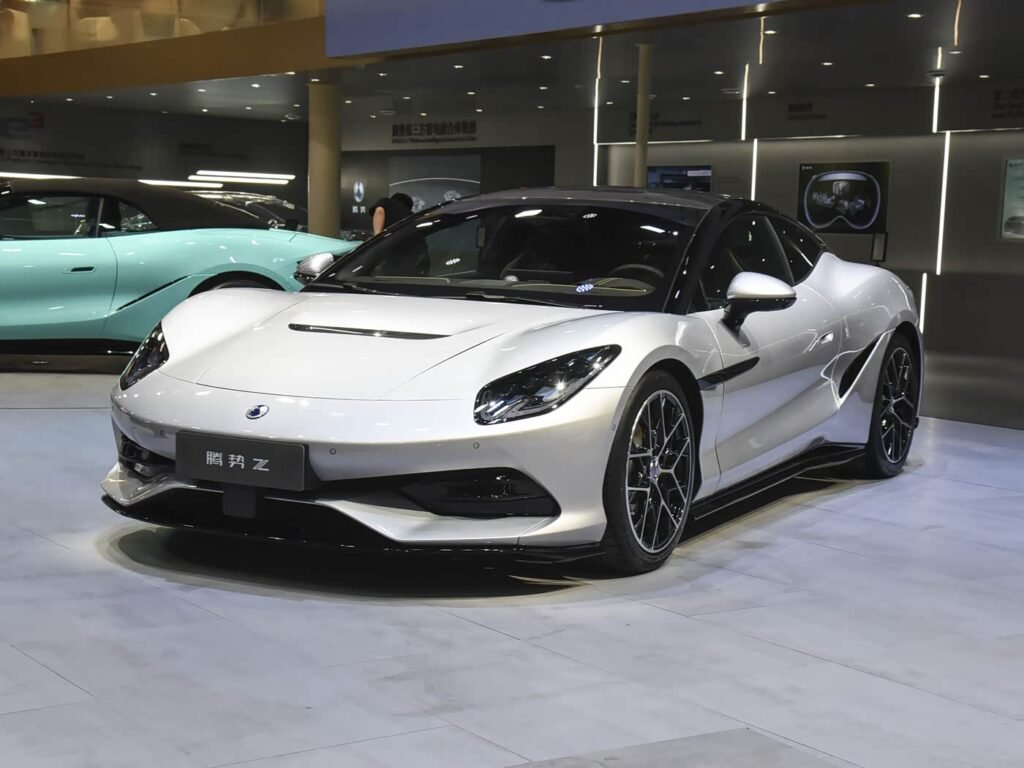 White Denza Z 2026 hardtop coupe at auto show, front three-quarter view, high-performance pure electric sports car