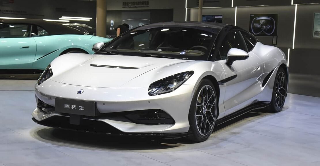 White Denza Z 2026 hardtop coupe at auto show, front three-quarter view, high-performance pure electric sports car